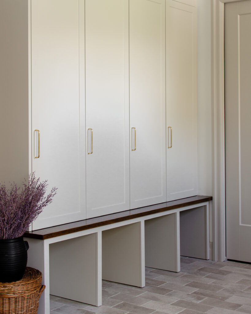 mudroom with limestone look tiles