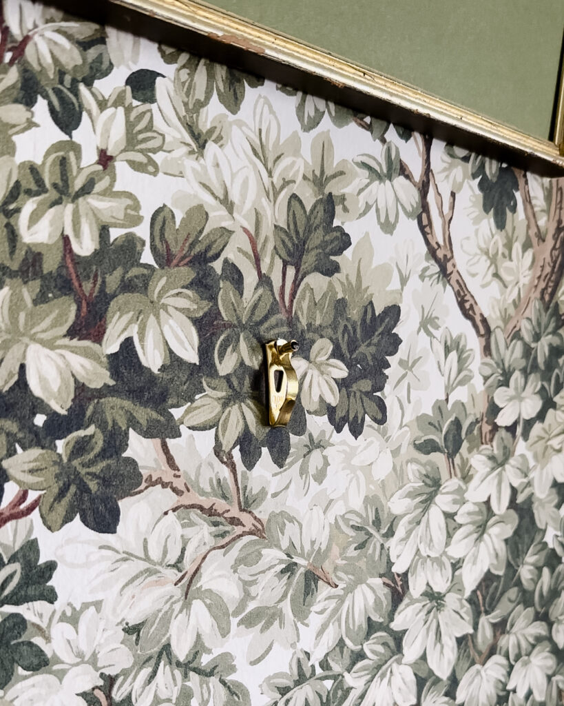 OOK kid-safe hanger on green forest wallpaper