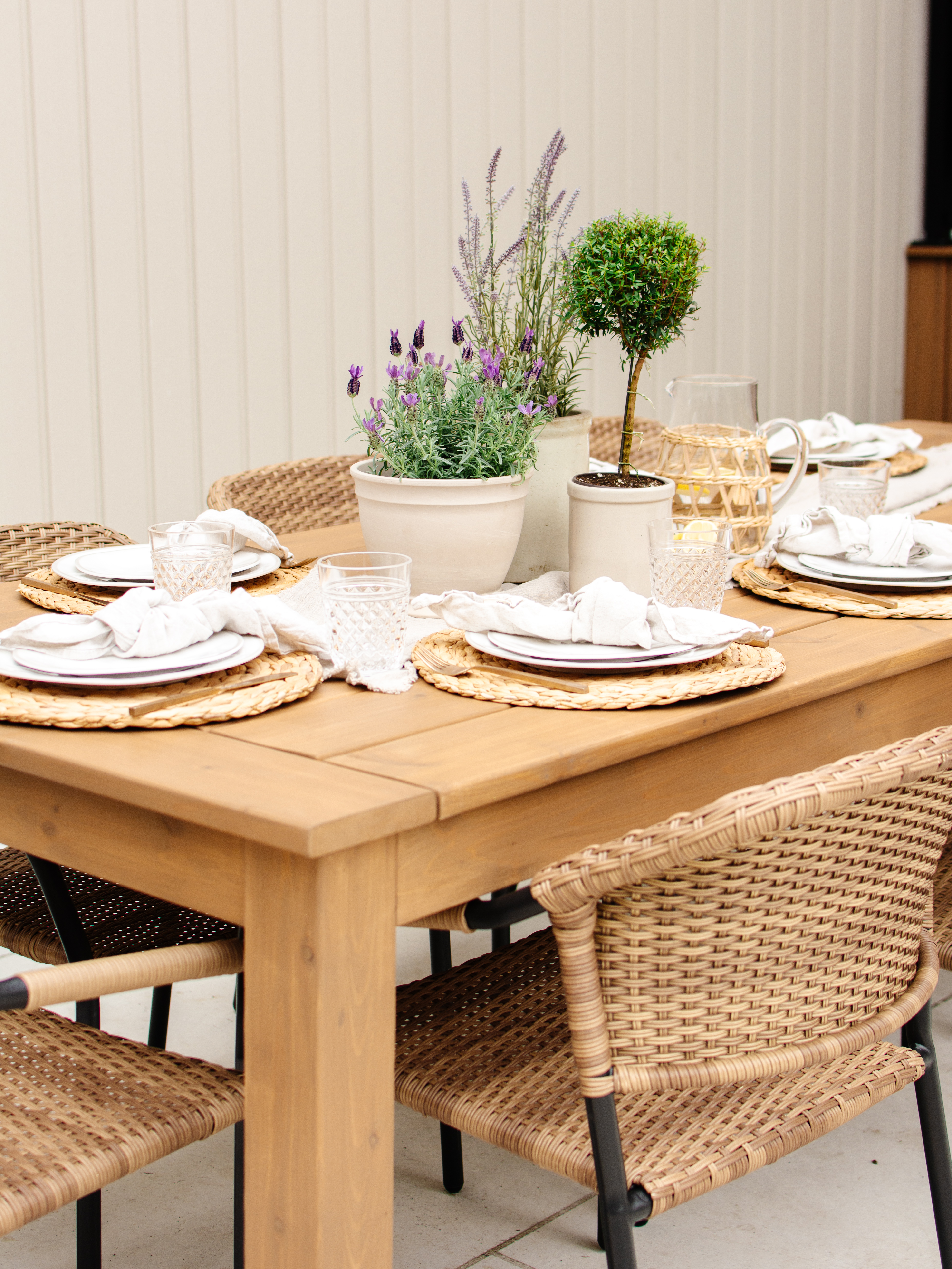 DIY patio dining table made of cedar stained in a warm brown stain